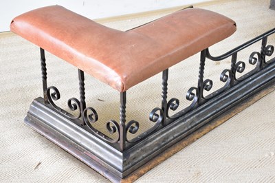 Lot 775 - A wrought iron club fender with scrolling...