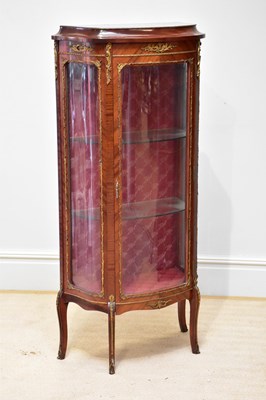 Lot 230 - A reproduction kingwood bowfront vitrine with...