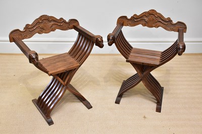 Lot 259 - A pair of reproduction X-framed throne chairs...