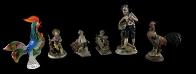 Lot 553 - CAPO-DI-MONTE; four assorted figurines...