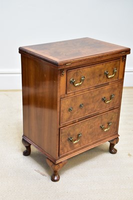 Lot 260 - A 1950s walnut chest, with fold-over top over...