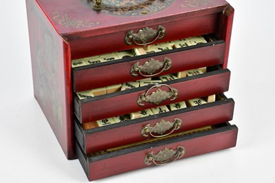 Lot 1255 - A modern Mahjong set in a red lacquered effect...