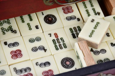 Lot 1255 - A modern Mahjong set in a red lacquered effect...