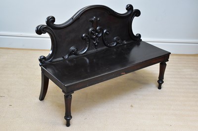 Lot 79 - A Victorian settle with carved back on fluted...