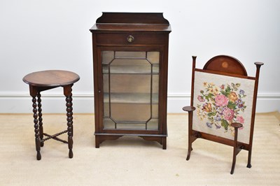 Lot 128 - An Edwardian mahogany cabinet with raised back...