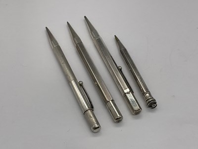 Lot 107 - Four sterling silver pencils.