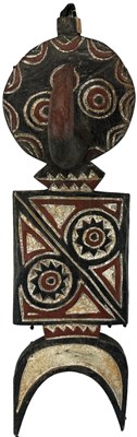 Lot 1063 - A small Bwa plank mask with red, white and...