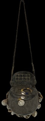 Lot 1227 - An African carved wooden purse with shell...