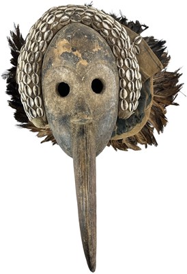 Lot 1064 - A Grebo Kru beak mask with shell decoration...