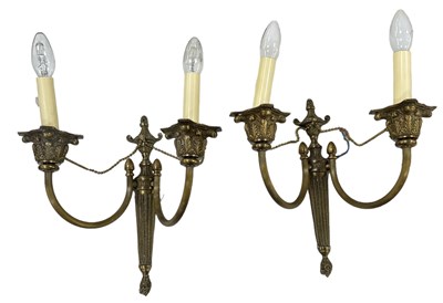 Lot 129 - A pair of brass two branch wall lights, height...