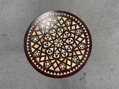 Lot 16 - An Islamic tripod table inlaid with mother of...