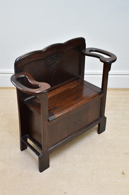Lot 42 - An early 20th century oak settle/stick stand...