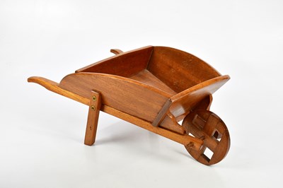 Lot 566 - A reproduction miniature wheelbarrow, length...