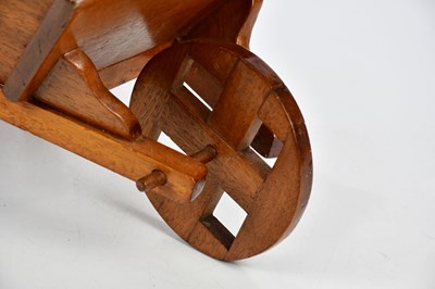 Lot 566 - A reproduction miniature wheelbarrow, length...