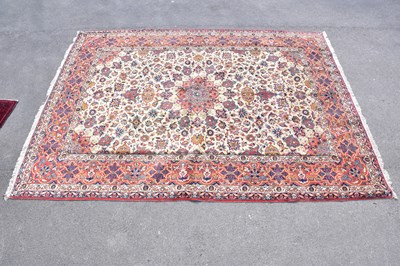 Lot 432 - A wool carpet with beige ground and geometric...