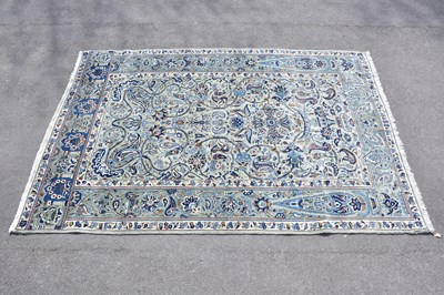 Lot 427 - A blue ground wool carpet with floral...