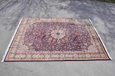 Lot 429 - A blue ground wool carpet with geometric...