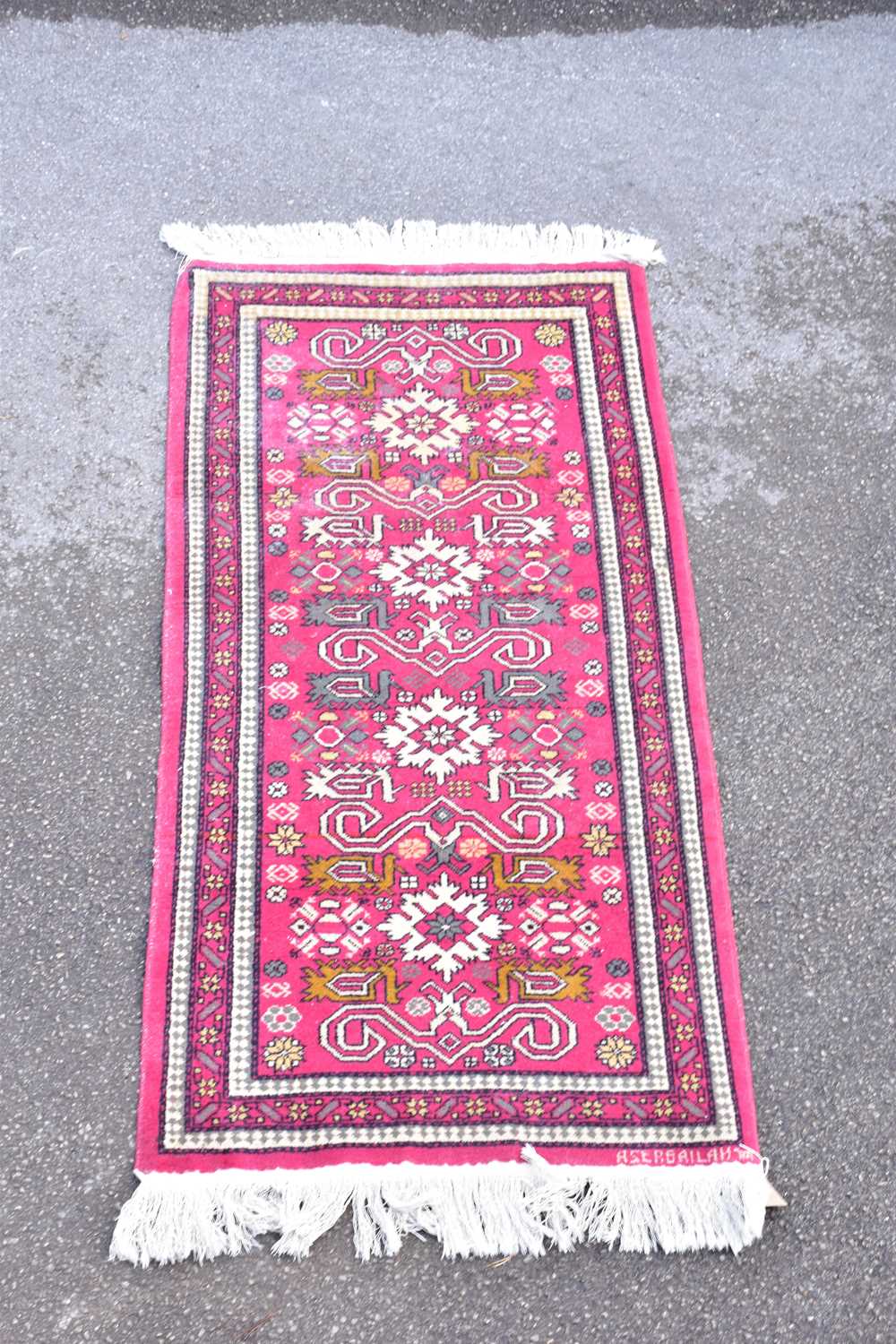 Lot 1492 - A Caucasian hand woven wool mat, with...