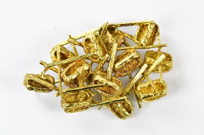 Lot 2500 - An 18ct yellow gold brooch of abstract design,...