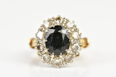 Lot 79 - A yellow metal diamond and sapphire dress ring,...