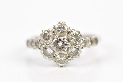 Lot 61 - An 18ct white gold diamond set floral dress...