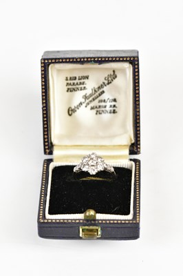 Lot 61 - An 18ct white gold diamond set floral dress...