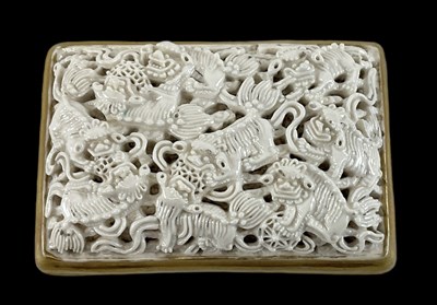 Lot 1063 - A Chinese porcelain belt buckle, panel moulded...