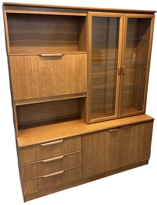 Lot 24 - A teak mid century wall unit, with pair of...