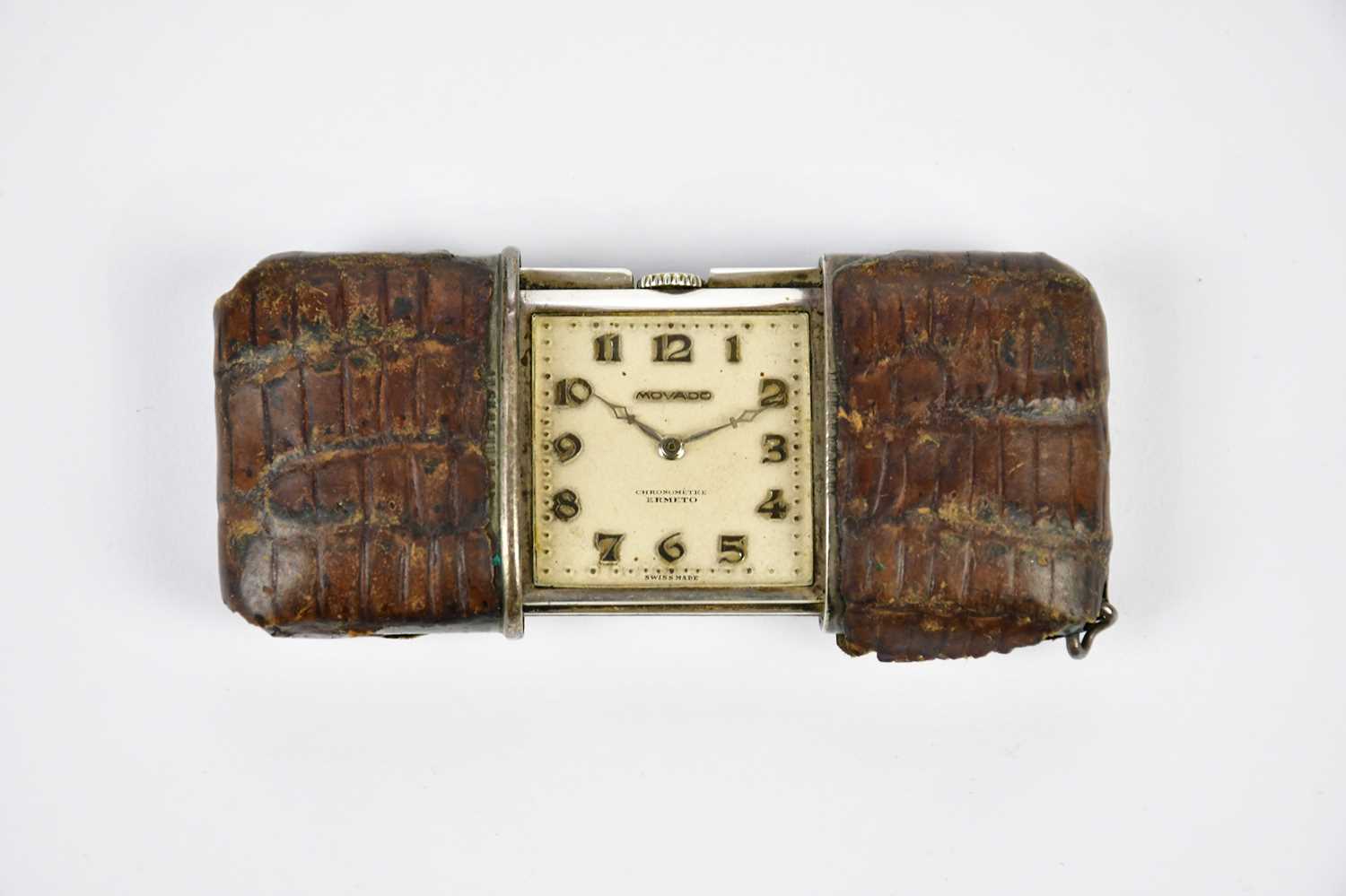 Lot 2354 - MOVADO; a crocodile skin cased purse watch,...