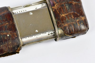 Lot 2354 - MOVADO; a crocodile skin cased purse watch,...