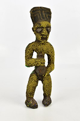 Lot 1327 - A Bamileke wood, clay and bead figure, height...