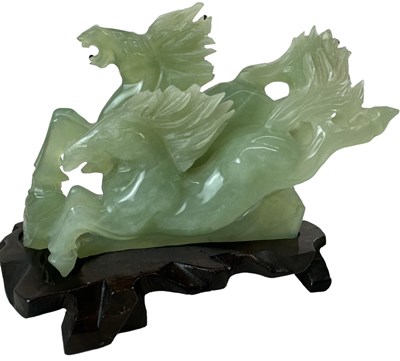 Lot 1141 - A modern Chinese green carved hardstone of two...