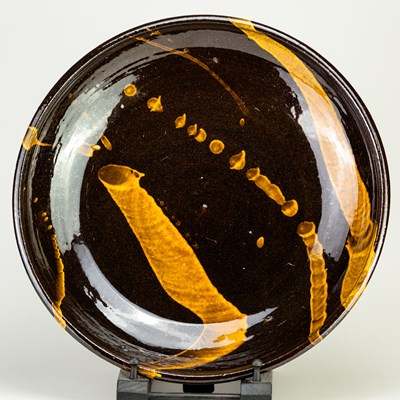 Lot 152 - CLIVE BOWEN (born 1943); a slipware charger...