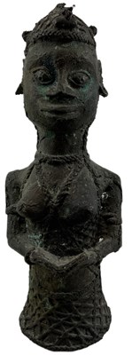 Lot 629 - A modern Benin type bronze of a lady reading a...