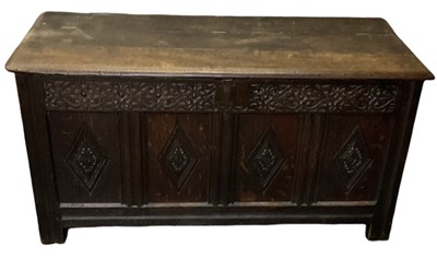Lot 31 - An 18th century carved oak coffer, with hinged...