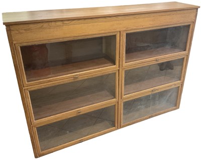 Lot 25 - A pine six section glazed display cabinet with...