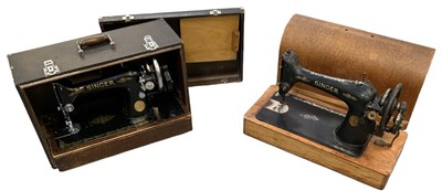 Lot 331 - Two cased Singer sewing machines.