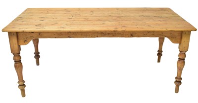Lot 50 - A large rustic pine farmhouse table of plank...