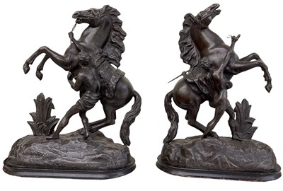 Lot 625 - A pair of spelter models of Marly horses,...