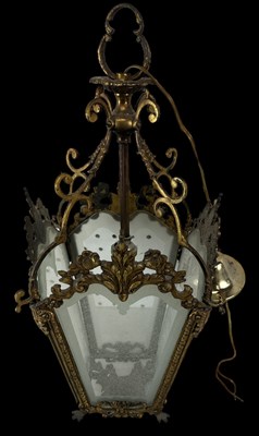 Lot 93 - An ornate brass four sided lantern with glass...