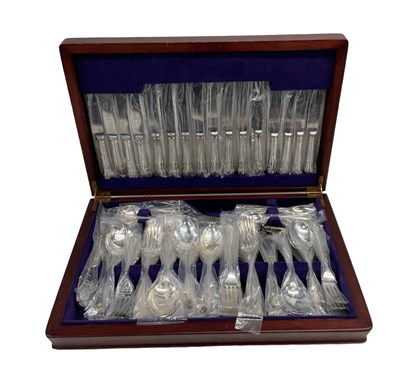 Lot 1236 - A cased Sheffield plate canteen of silver...