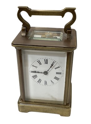 Lot 138 - A brass cased carriage clock, the white enamel...