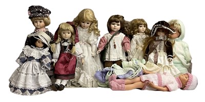 Lot 512 - A group of nine porcelain headed dolls.