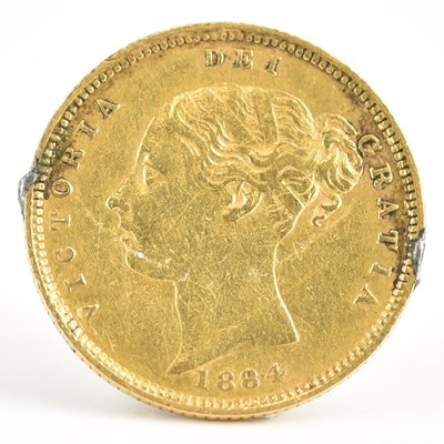 Lot 924 - A Victorian 1884 half sovereign, young head,...