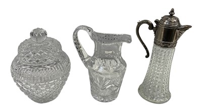 Lot 617 - A cut glass pewter mounted claret jug, height...