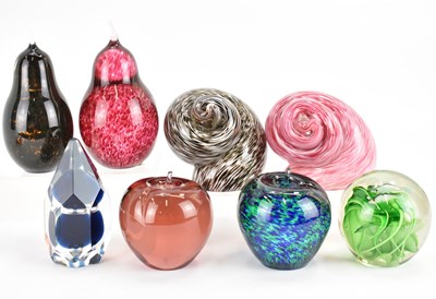 Lot 365 - Eight glass paperweights to include pear,...