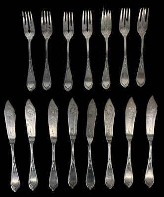 Lot 1250 - A set of eight French silver fish knives and...