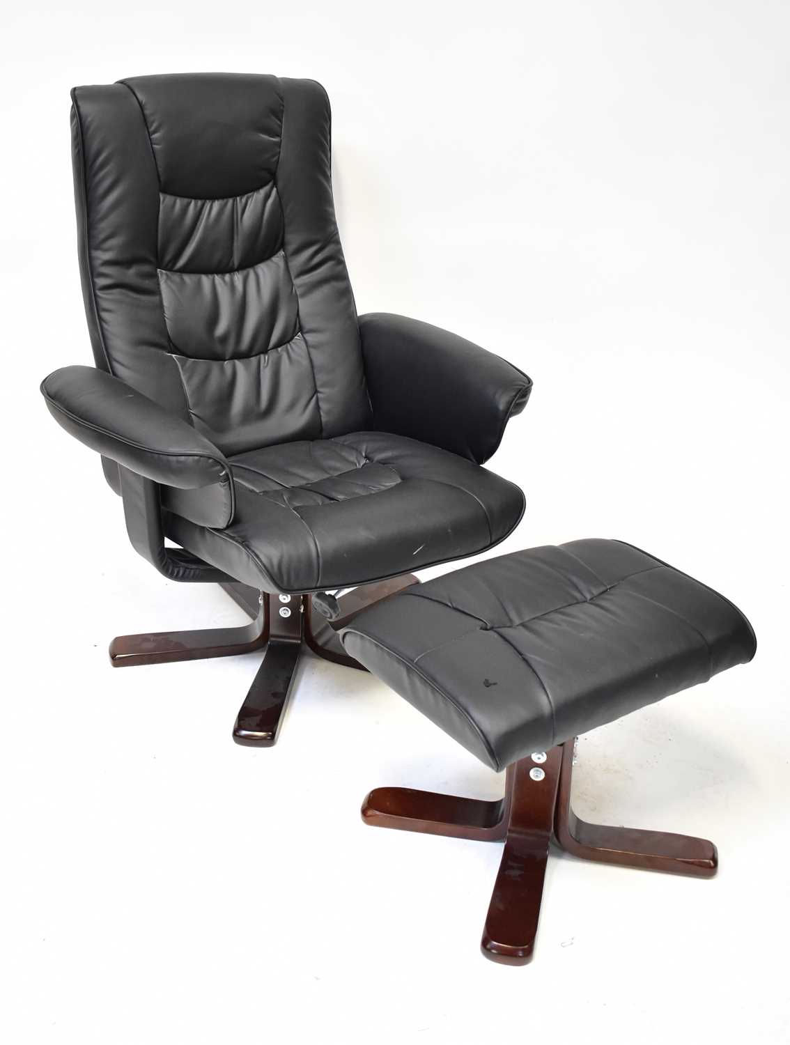Lot 14 - A black faux leather reclining lounge chair...