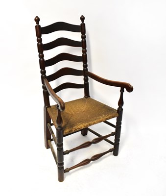 Lot 13 - A 19th century country made rush-seated ladder...