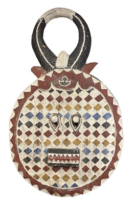 Lot 1058 - A large African Baule mask with red, white,...